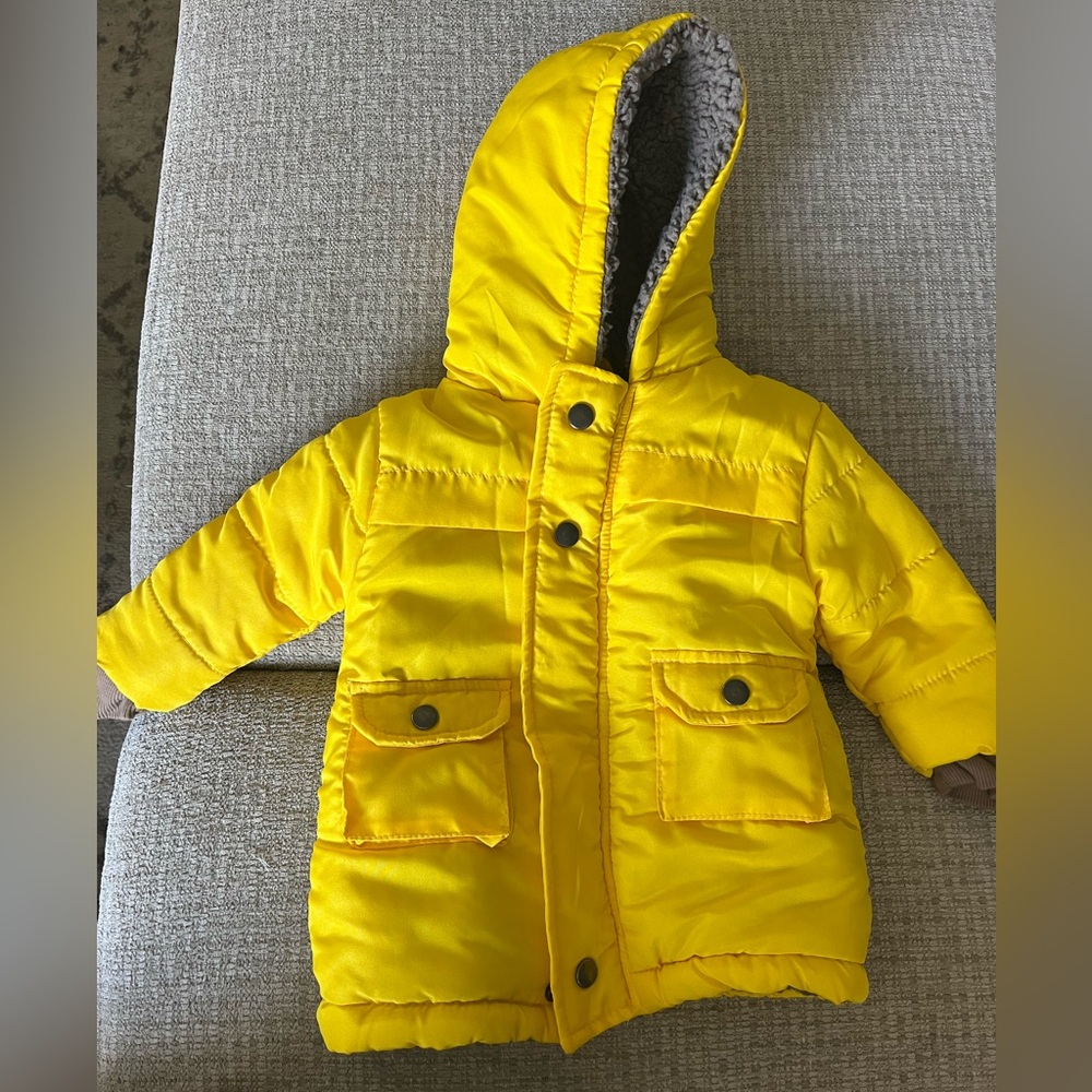 Yellow jacket with pockets and fuzzy lining.